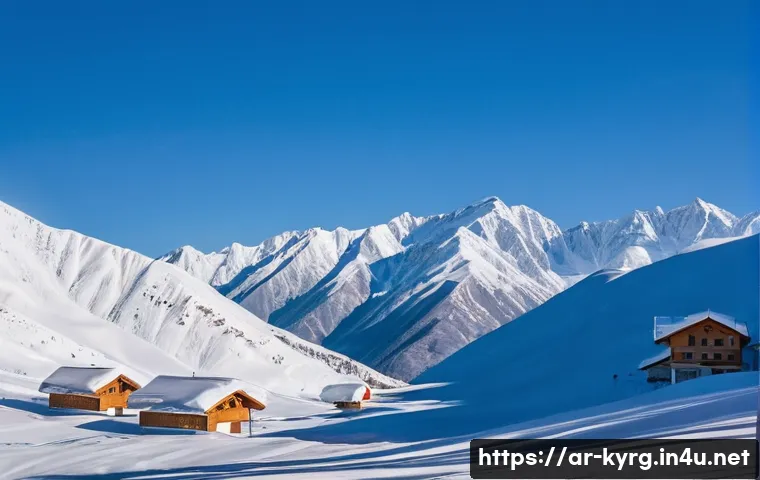 키르기스스탄 겨울 스포츠 - A breathtaking winter landscape of Kyrgyzstan&rsquo;s Tian Shan mountains towering over deep snow-covered ...